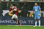 AC Milan's Giampaolo Pazzini (L) celebrates after scoring during a Serie A match against Catania on April 28, 2013
